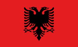 Flag of Albania: red field with a black double-headed eagle in the center.